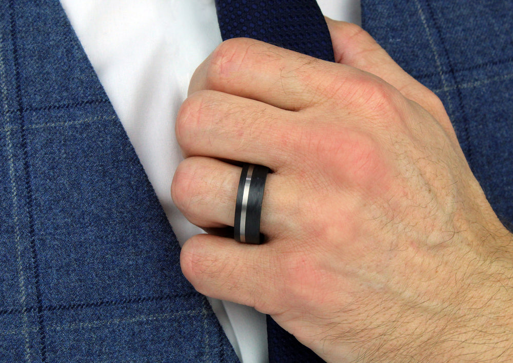 Model wearing Black Carbon Fibre ring with Stripe options in Titanium or Palladium 500, 8mm wide, 2.6mm deep, Flat profile, 59315-003-000-N200