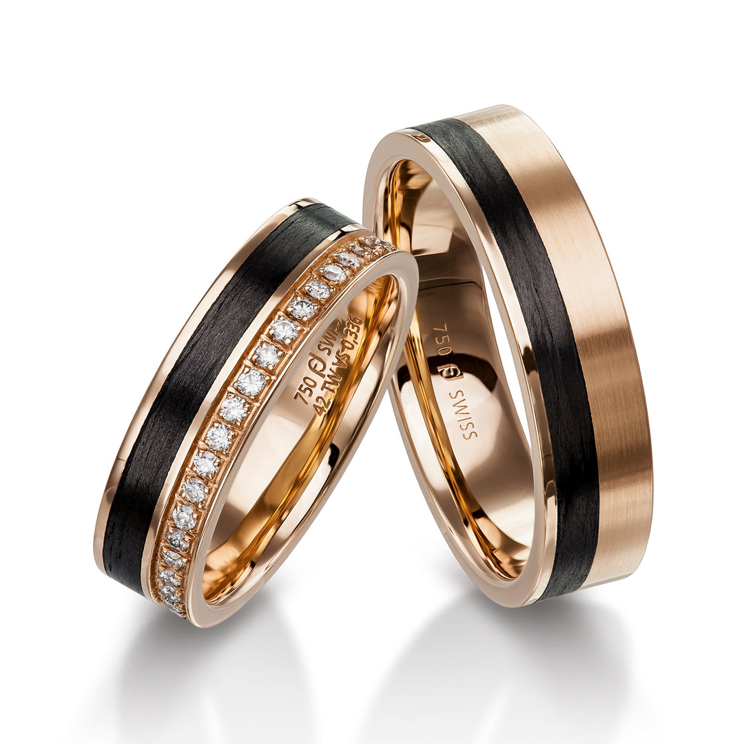 Pair of Furrer Jacot rings, 18ct Rose Gold & Black Carbon Fibre set with 20 brilliant cut round diamonds (approx total weight 0.16ct) graded F/G vs, 5.5mm wide, 1.8mm deep, 61-53150 & 71-32150