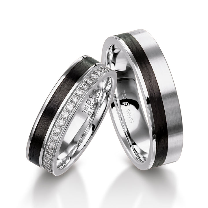 Pair of Furrer Jacot rings, 18ct White Gold & Black Carbon Fibre set with 20 brilliant cut round diamonds (approx total weight 0.16ct) graded F/G vs, 5.5mm wide, 1.8mm deep, 61-53150 & 71-32150