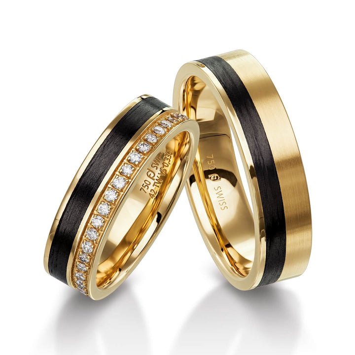 Pair of Furrer Jacot rings, 18ct Yellow Gold & Black Carbon Fibre set with 20 brilliant cut round diamonds (approx total weight 0.16ct) graded F/G vs, 5.5mm wide, 1.8mm deep, 61-53150 & 71-32150