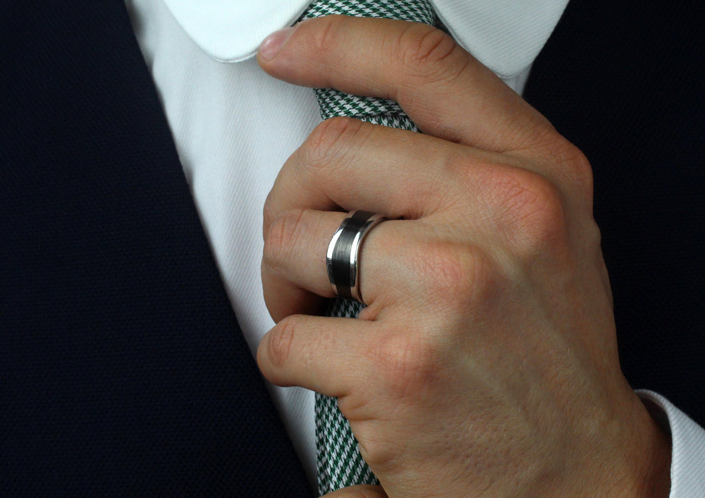 Platinum & Black Carbon Fibre Wave Ring worn by model, 8mm wide & 2.3mm deep, Designed by Furrer Jacot